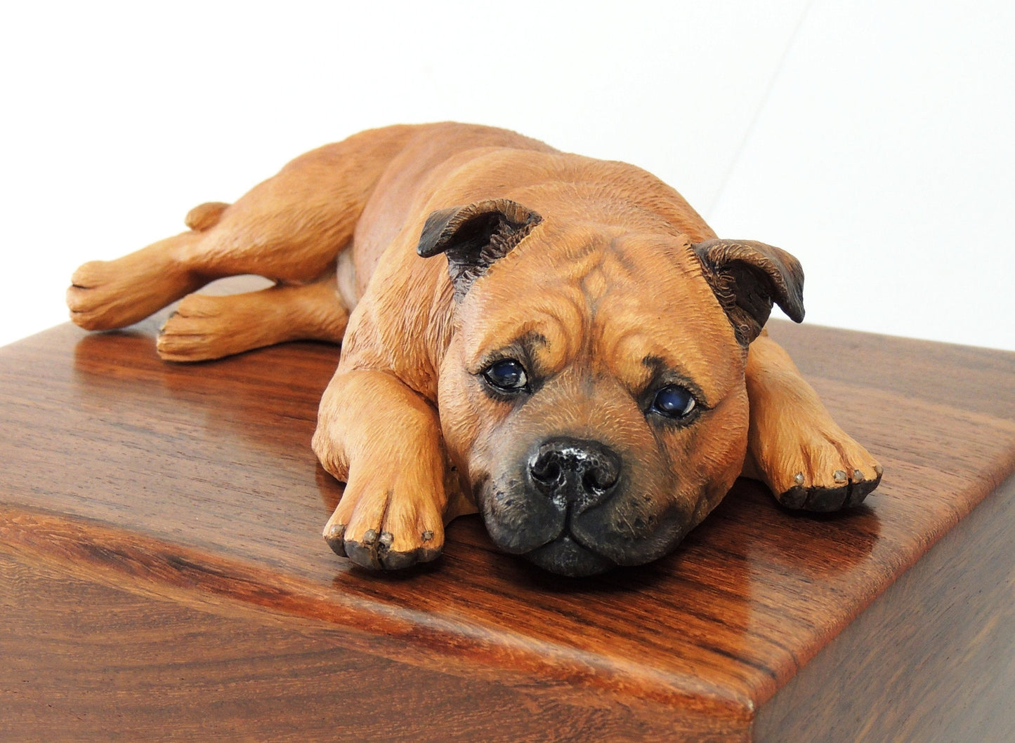 Sculpture of a red staffordshire bull terrier