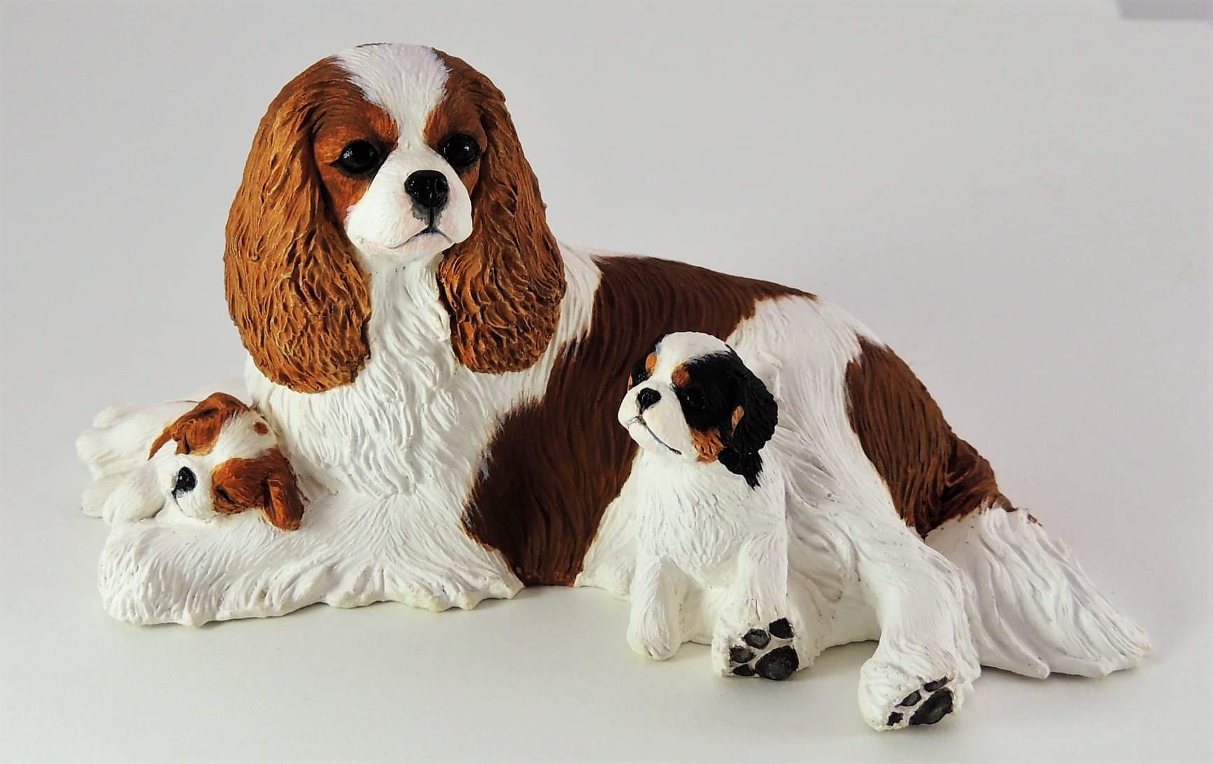 cavalier king charles spaniel and puppies sculpture